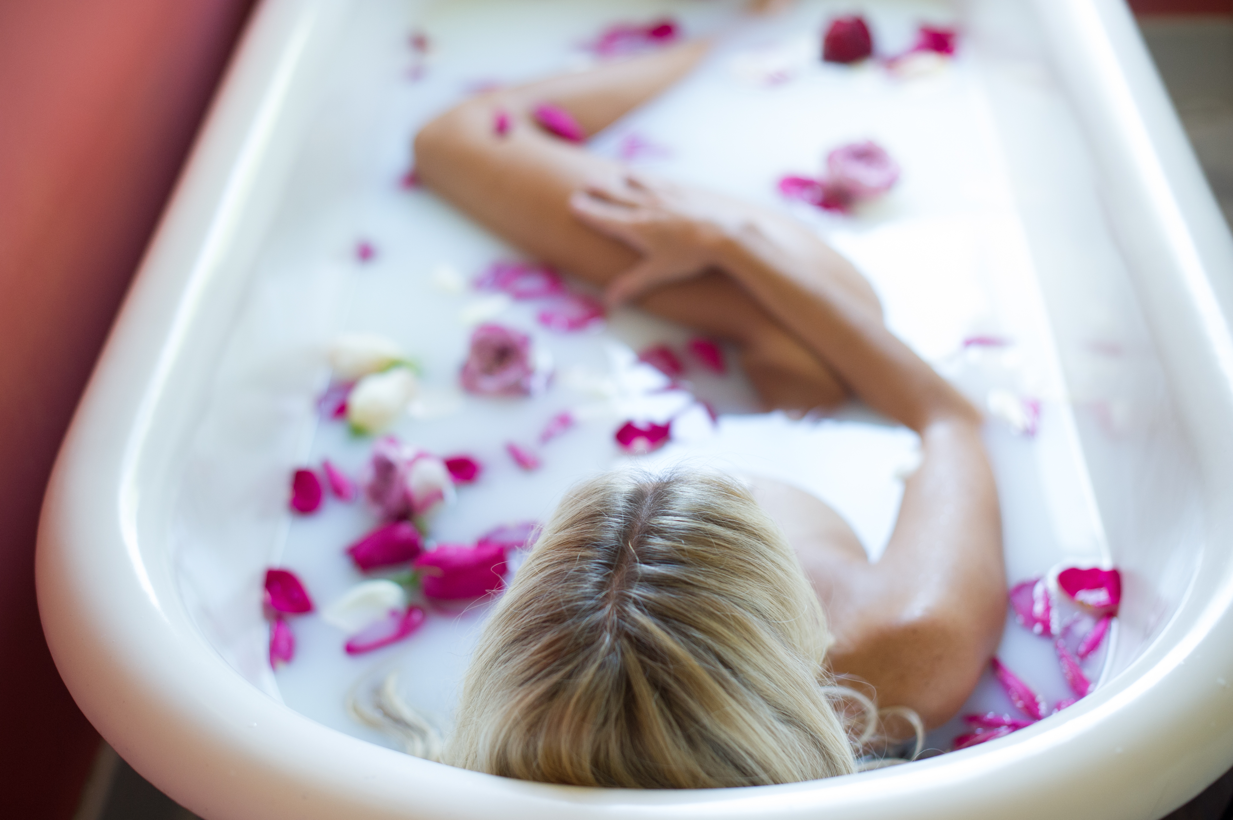 Woman taking a rose bath